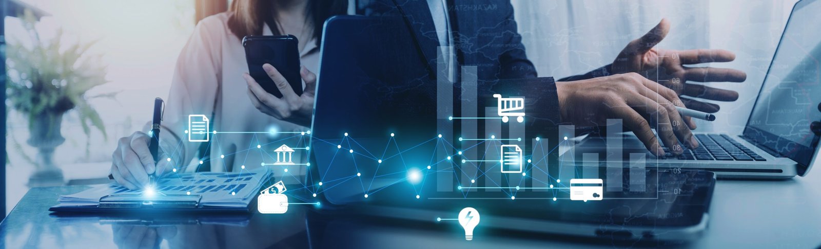 Man holding credit card and using smartphone at home office, bus